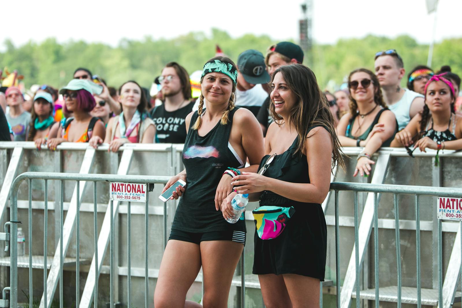 Two friends enjoying a concert together