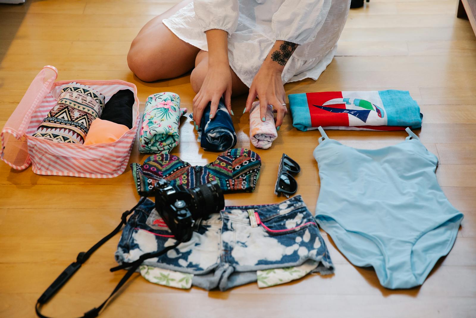 Person packing a personal item bag