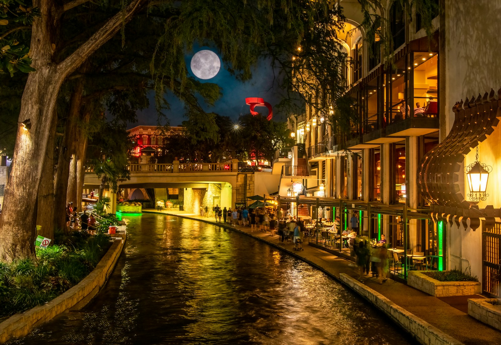 San Antonio, Texas a river running through a city at night