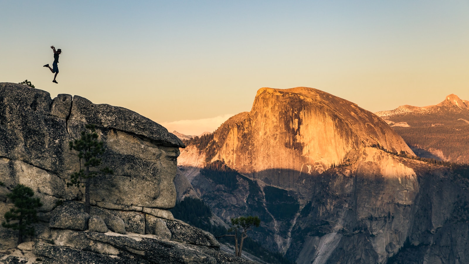 Top Adventure Destinations in the USA man jumping on cliff