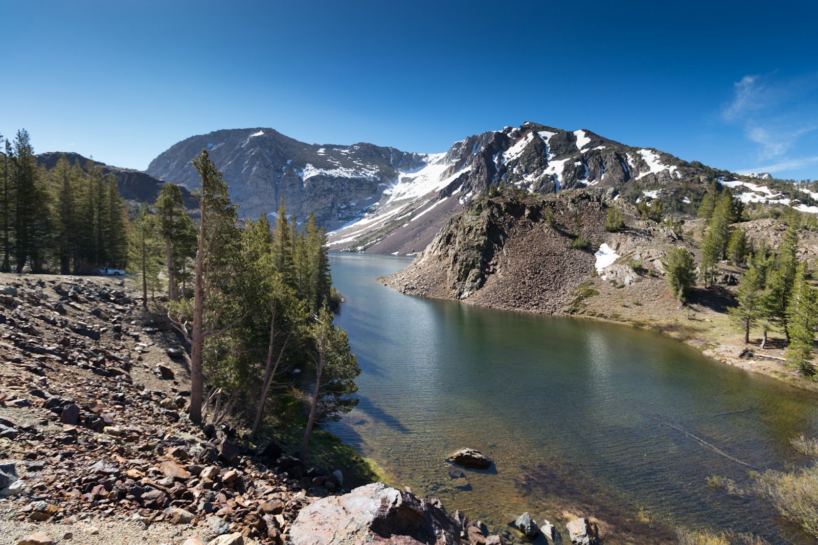 National Parks body of water near mountain at daytime