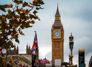 The big ben clock tower towering over the city of london